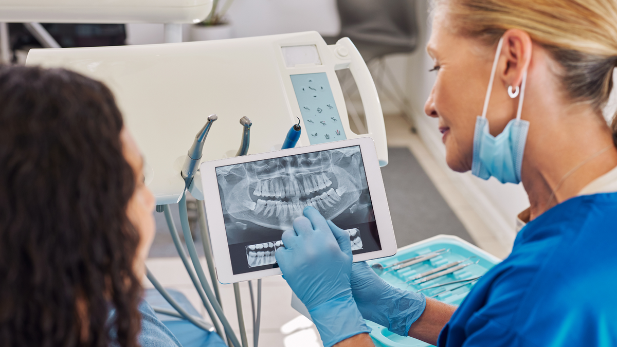 Dentist Discussing Dental X-Rays With Patient