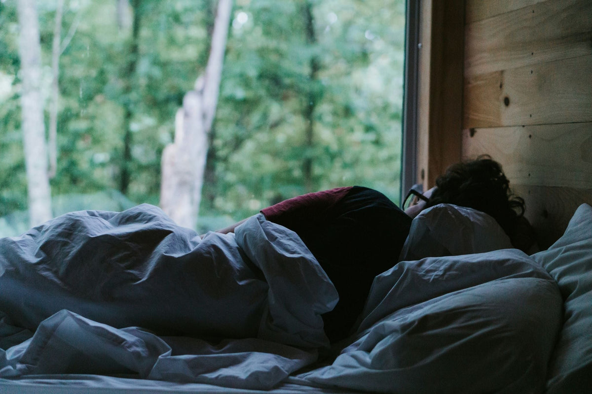 Person Lying in Bed