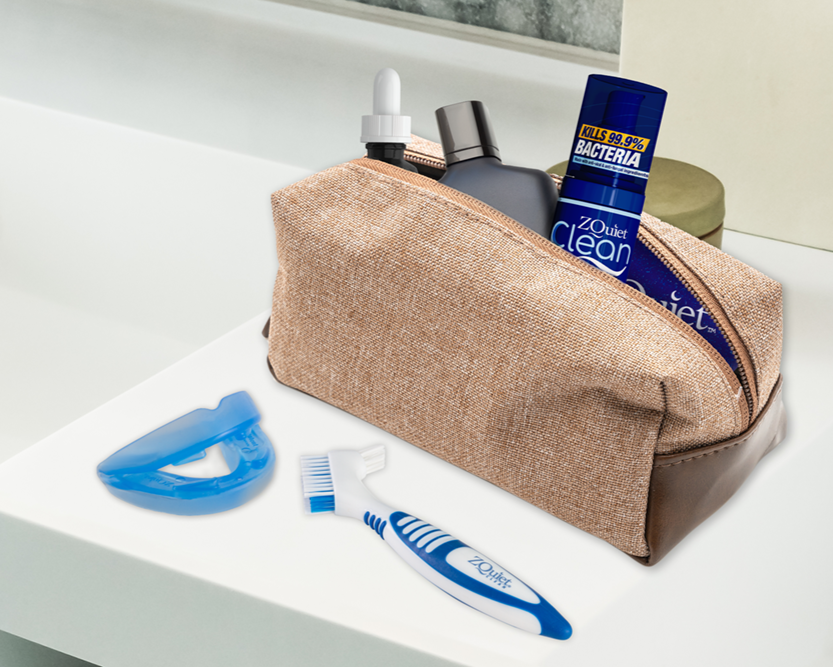 ZQuiet mouthpiece, appliance brush, appliance cleaner shown in a bathroom with a travel kit