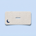 A single strip of ZQuiet Breathe Mouth Tape on a blue background
